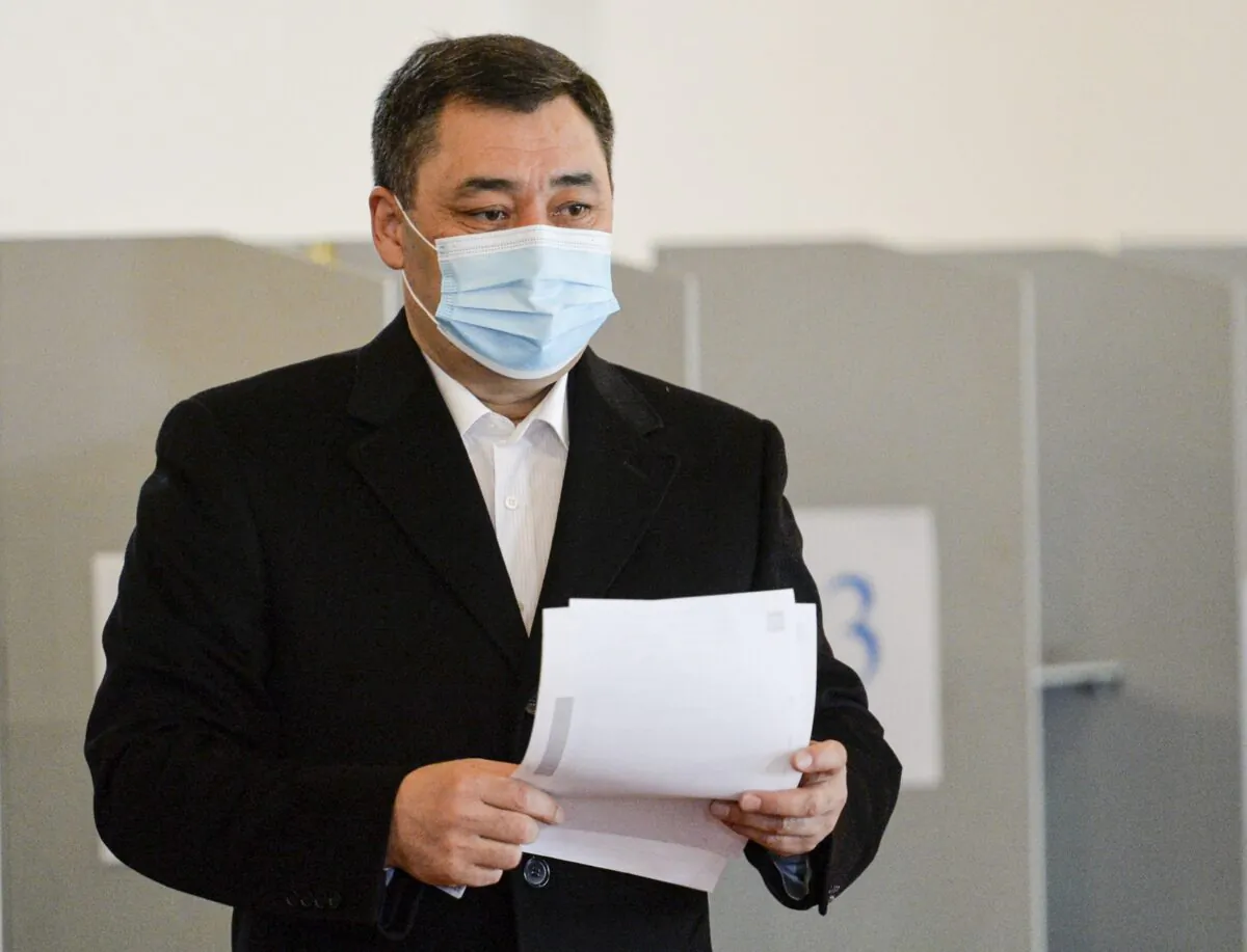 Sadyr Zhaparov, the top presidential candidate, walks to cast his ballot at a polling station in Bishkek, Kyrgyzstan, on Jan. 10, 2021. (Vladimir Voronin/AP Photo)