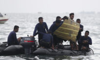 Indonesian Divers Find Parts of Plane Wreckage in Java Sea