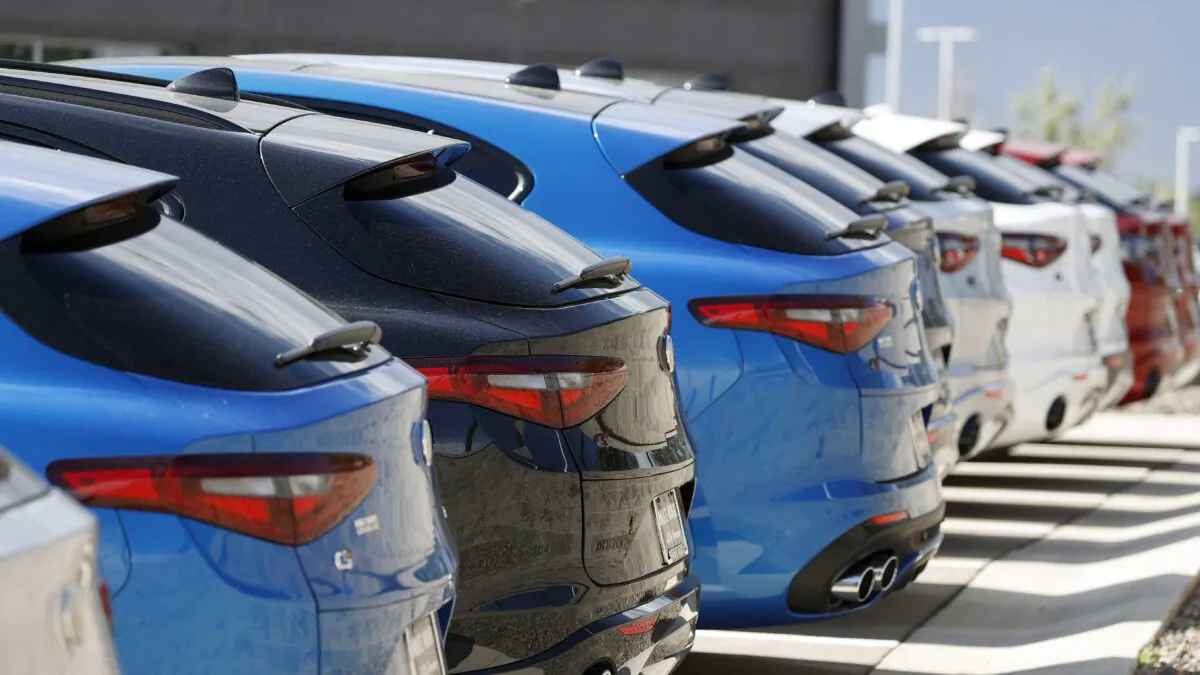 A long row of unsold 2020 Stelvio sports-utility vehicles sits at an Alfa Romeo dealership, in Highlands Ranch, Colo., on July 19, 2020. (David Zalubowski/AP Photo)