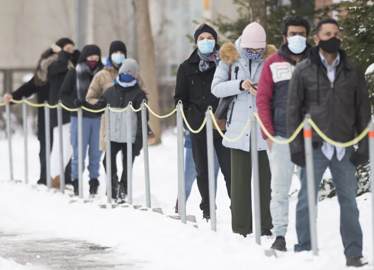 People wait to be tested for COVID-19 at a clinic in Montreal on Jan. 3, 2021. (The Canadian Press/Graham Hughes)