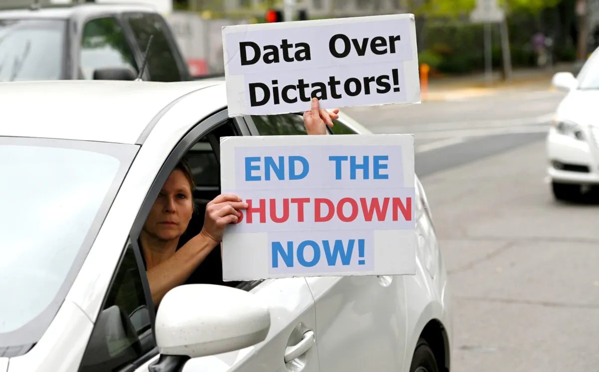 Protesters call for an end to lockdowns at California's state Capitol building in Sacramento, Calif., on April 20, 2020. (Josh Edelson/AFP via Getty Images) 