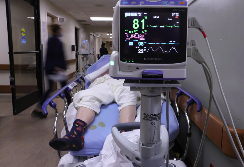 A patient lies on a stretcher in a hallway in the overloaded emergency room at Providence St. Mary Medical Center amid a surge in COVID-19 patients in Apple Valley, Calif., on Jan. 5, 2021. (Mario Tama/Getty Images)