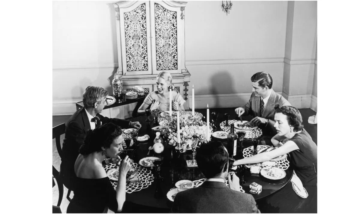 A dinner party, circa 1955. (Hulton Archive/Getty Images)
