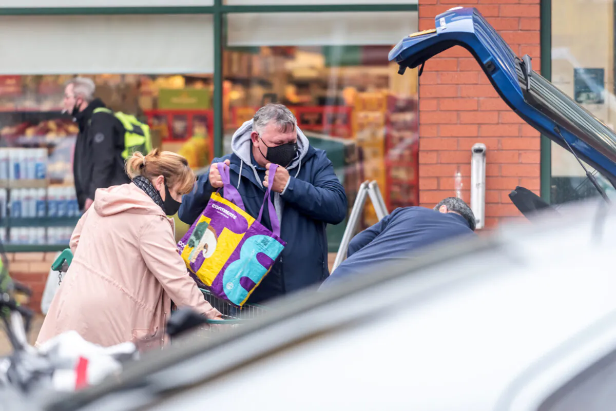 Shoppers outside a branch of Morrisons in Portsmouth, UK, on Dec. 21, 2020. (Andrew Hasson/Getty Images)
