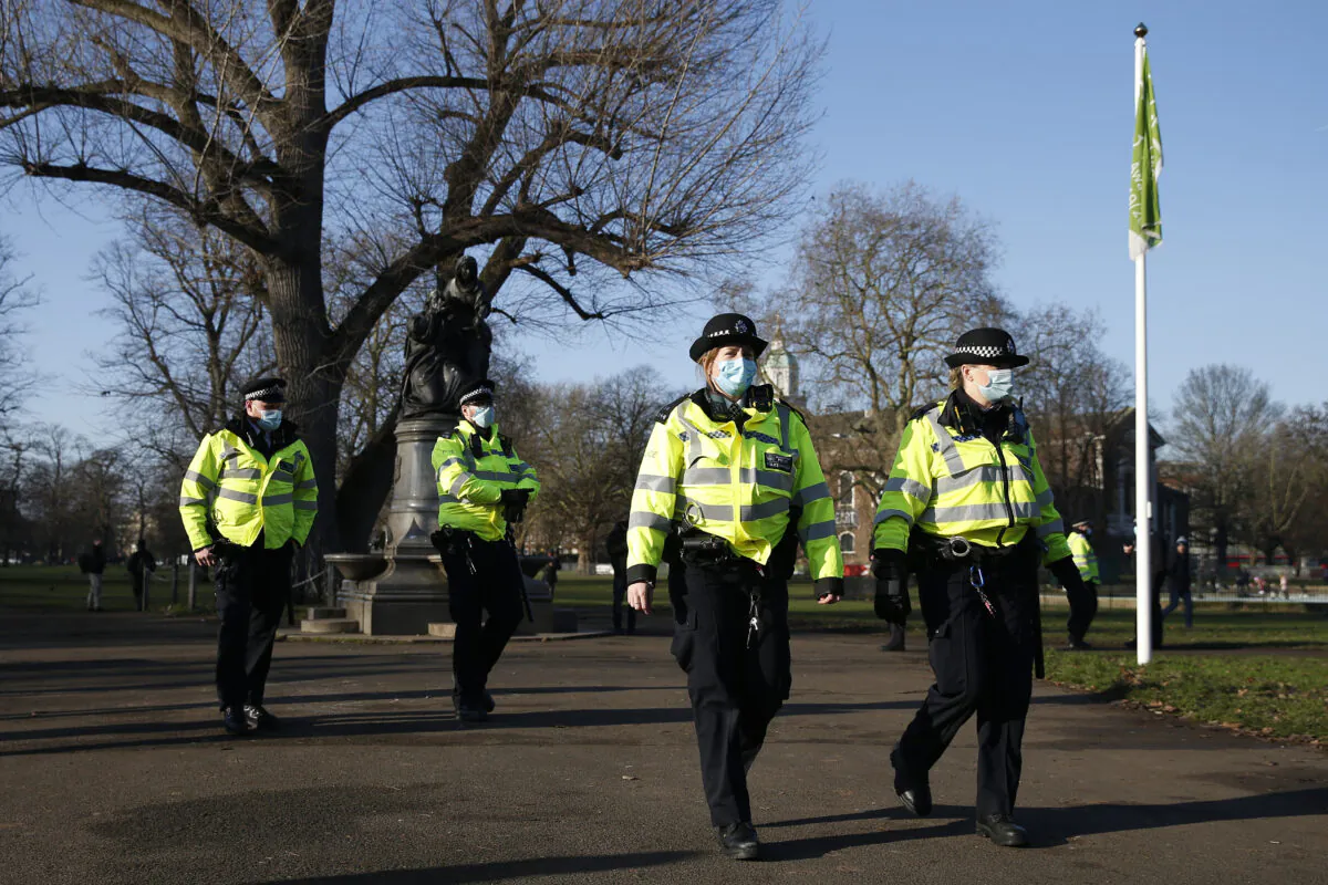 Police maintain a presence at Clapham Common during an anti-lockdown demonstration in London on Jan. 9, 2021. (Hollie Adams/Getty Images)