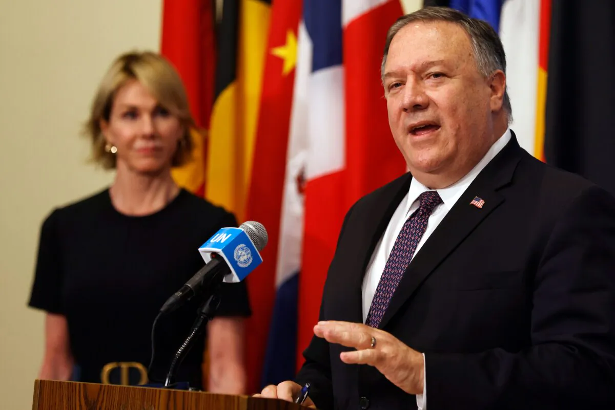 U.S. Secretary of State Mike Pompeo is flanked by U.S. Ambassador to the United Nations Kelly Craft as he speaks to reporters at the United Nations headquarters in New York, on Aug. 20, 2020. (Mike Segar/POOL/AFP via Getty Images)