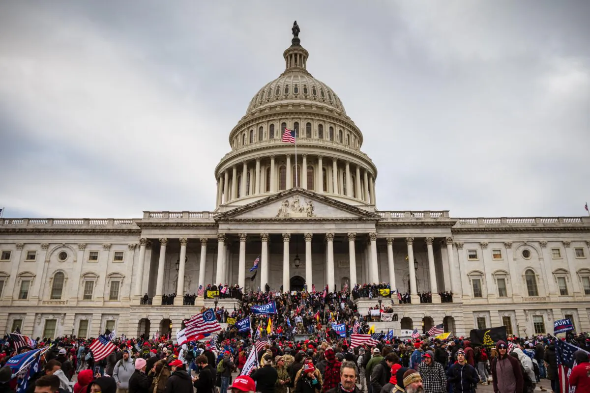 A large group of protesters stand on the East steps of the Capitol Building in Washington, on Jan. 6, 2021. (Jon Cherry/Getty Images)