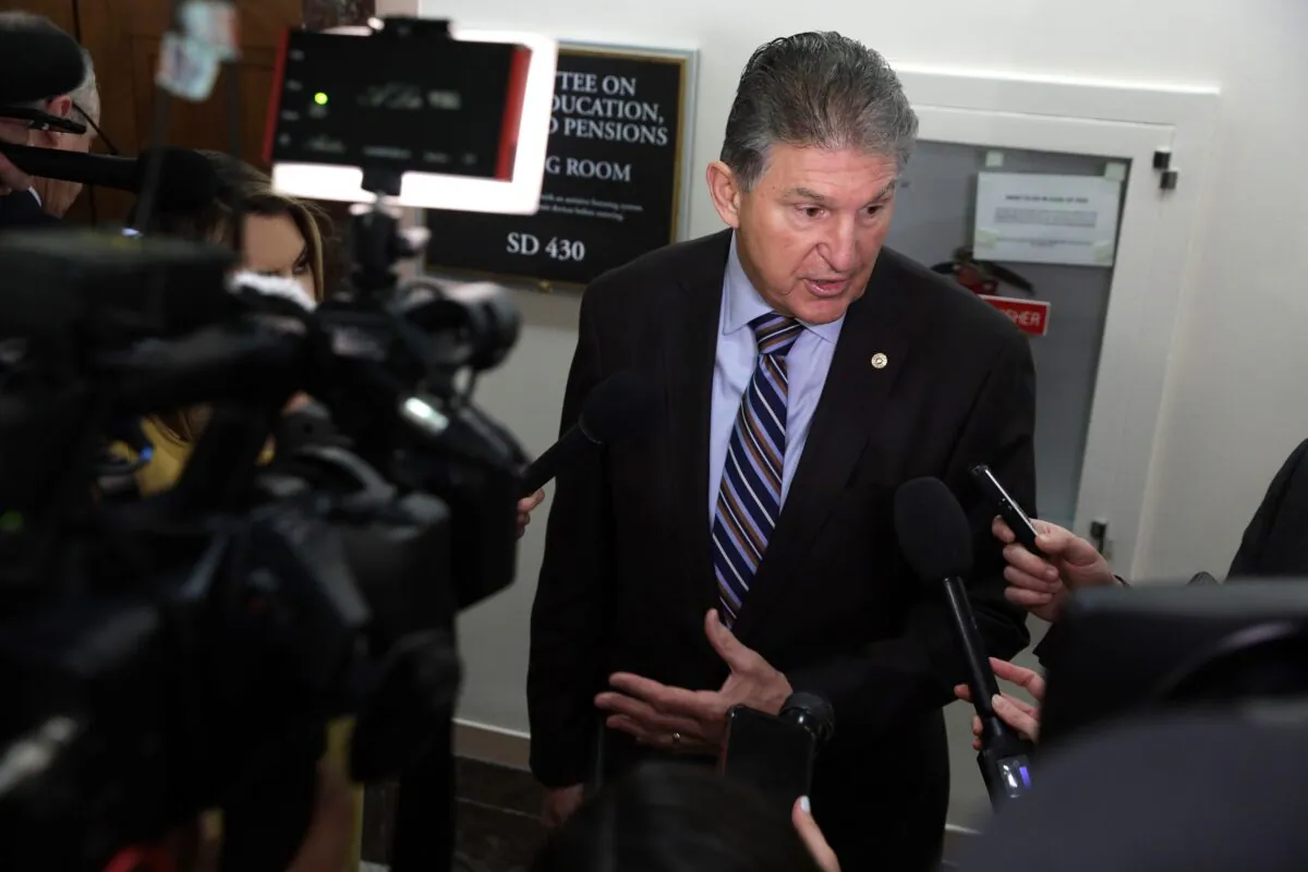Sen. Joe Manchin (D-W.Va.) speaks to reporters in Washington on March 12, 2020. (Alex Wong/Getty Images)