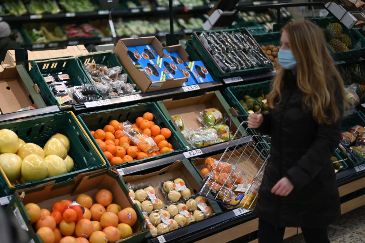 A shopper in a Tesco supermarket in London on Dec. 14, 2020. (Daniel Leal-Olivas/AFP via Getty Images)
