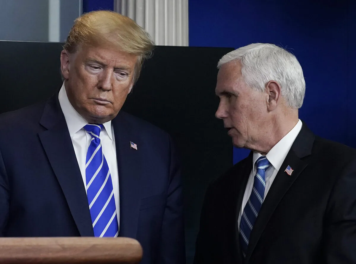 Former President Donald Trump and former Vice President Mike Pence confer during a briefing in Washington on April 23, 2020. (Drew Angerer/Getty Images)