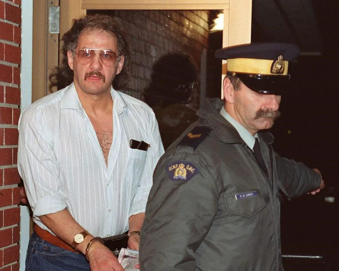 Allan Legere leaves court in Burton, N.B., as he waits for jurors in his murder trial to return a verdict on Nov. 2, 1991. (The Canadian Press/Andrew Vaughan)