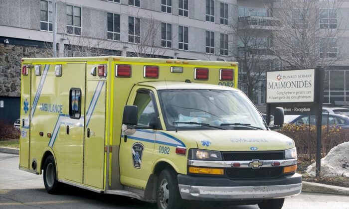 An ambulance leaves Maimonides Geriatric Centre in Montreal, on Nov. 29, 2020, as the COVID-19 pandemic continues in Canada and around the world. (The Canadian Press/Graham Hughes)