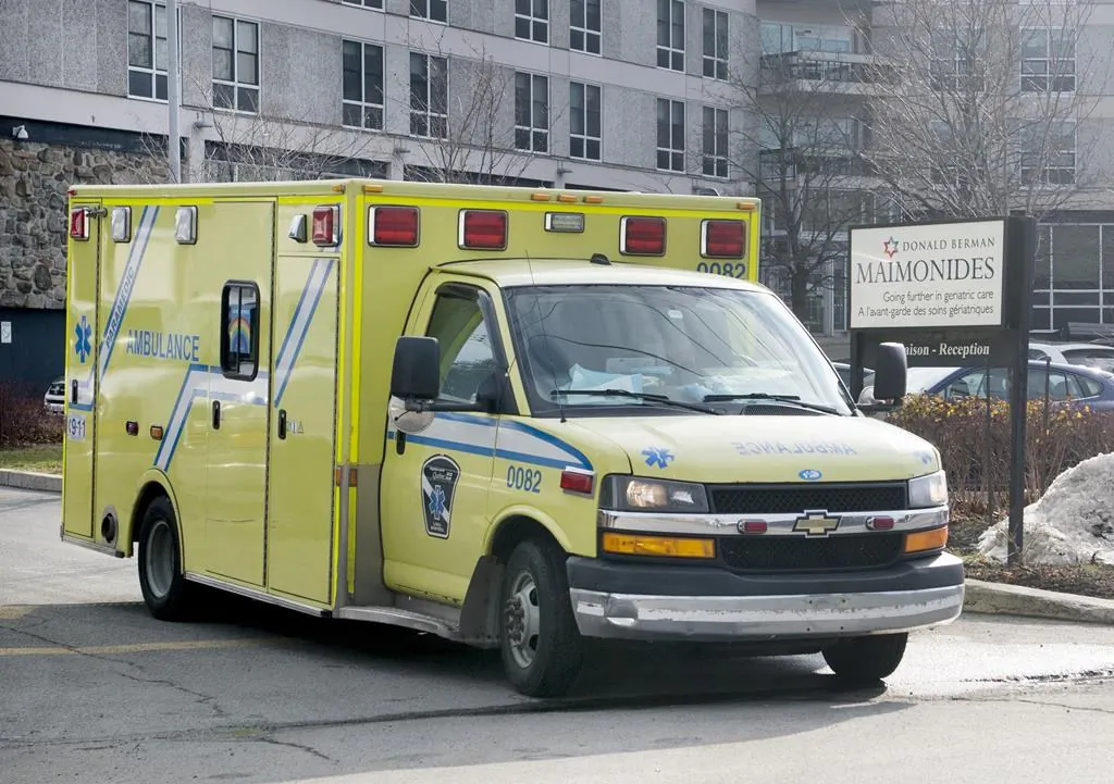 An ambulance leaves Maimonides Geriatric Centre in Montreal, on Nov. 29, 2020, as the COVID-19 pandemic continues in Canada and around the world. (The Canadian Press/Graham Hughes)