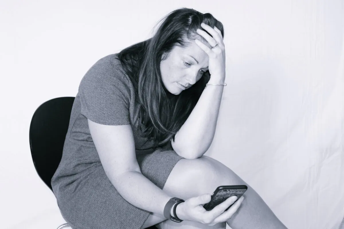 A woman showing stress in a file photo. (Chloe Capture/flickr)
