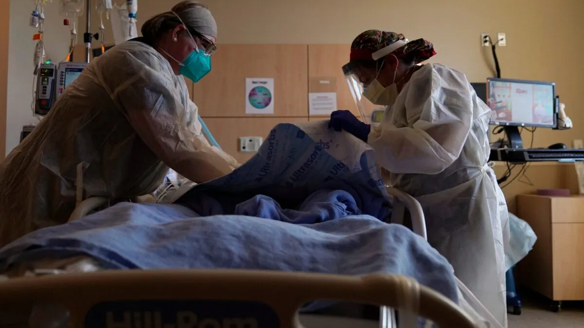 Registered nurses treat a COVID-19 patient at Providence Holy Cross Medical Center in the Mission Hills section of Los Angeles, Calif., on Dec. 22, 2020. (Jae C. Hong/AP Photo)