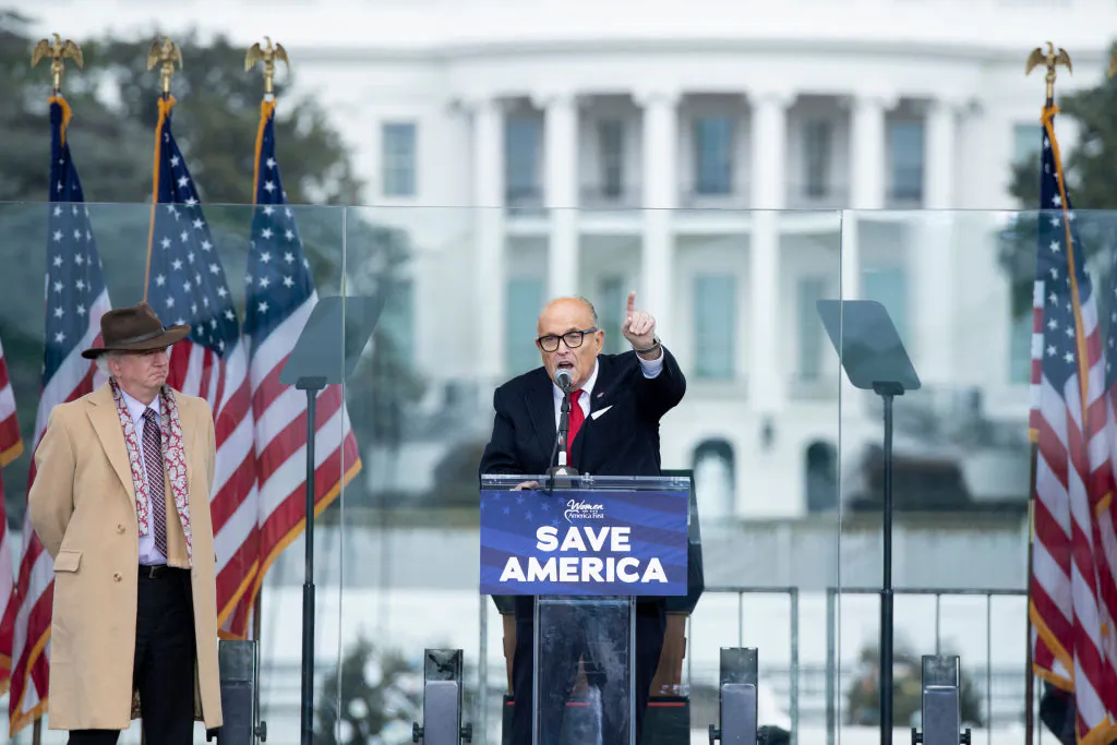 Chapman University law professor John Eastman (L) watches as Rudy Giuliani speaks to supporters from The Ellipse near the White House in Washington on Jan. 6, 2021. (Brendan Smialowski/AFP via Getty Images)