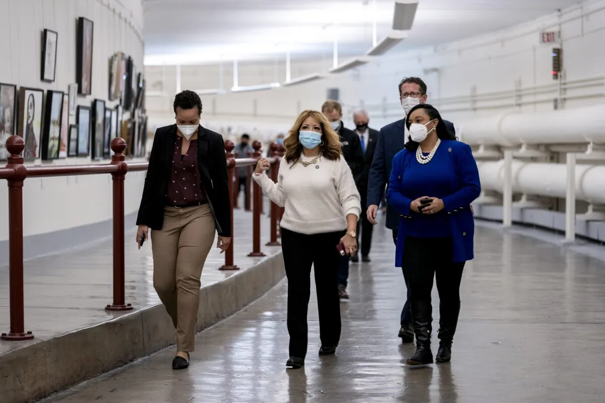 Rep. Lucy Mcbath (D-Ga.) (C) walks while wearing a mask through the Canon Tunnel to the U.S. Capitol in Washington on Jan. 12, 2021. (Stefani Reynolds/Getty Images)