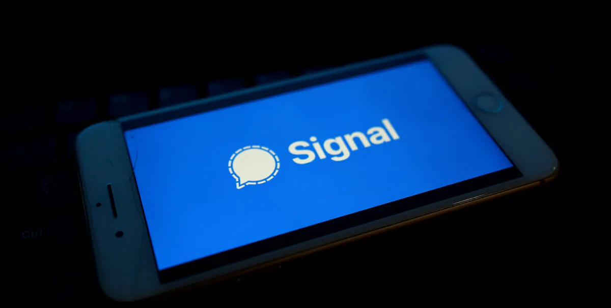 Messaging service Signal's logo is displayed on a mobile phone in a file photo. (Edward Smith/Getty Images)