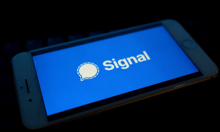 Messaging service Signal's logo is displayed on a mobile phone in a file photo. (Edward Smith/Getty Images)