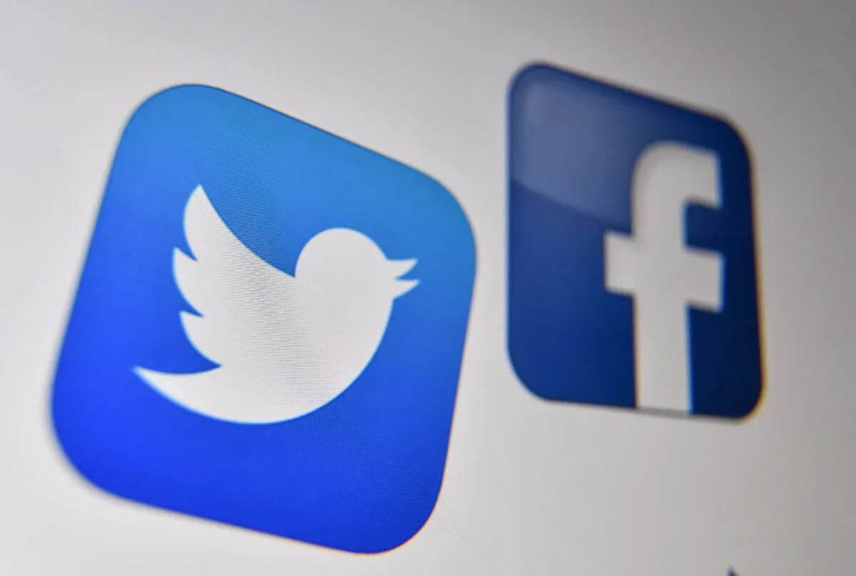 A photo shows the logos of the online social media and social networking services Facebook and Twitter on a computer screen in Lille on Oct. 21, 2020. (Denis Charlet/AFP via Getty Images)
