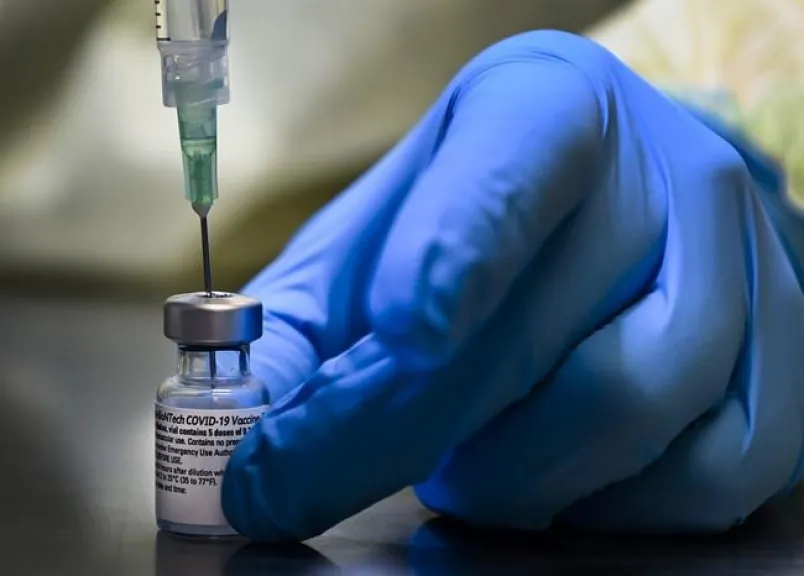 A health-care worker prepares a dose of the Pfizer-BioNTech COVID-19 vaccine at a vaccine clinic in Toronto on Jan. 7, 2021. (The Canadian Press/Nathan Denette)
