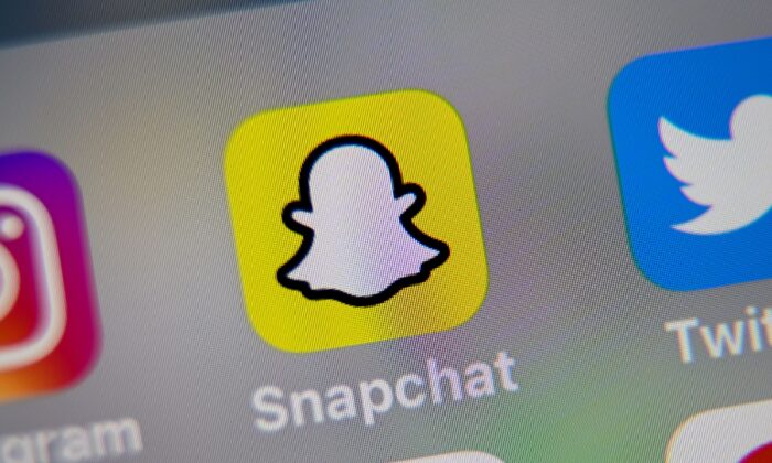 A representation   of a mobile telephone  shows the logo of Snapchat, connected  Oct. 1, 2019. (Denis Charlet/AFP via Getty Images)