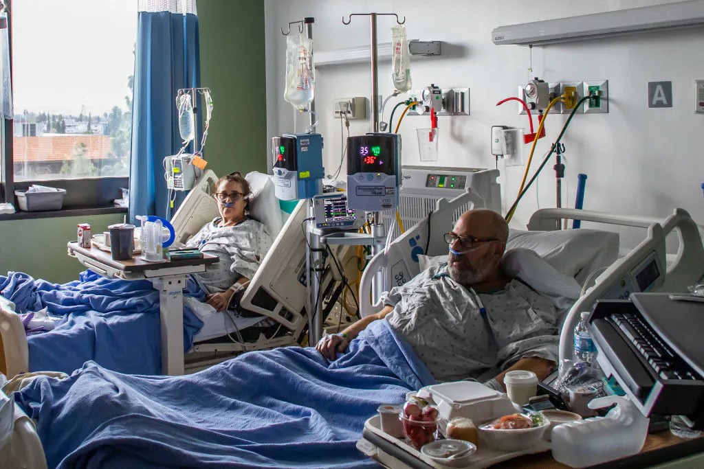 Dr. Neil Hecht and his wife Mindy Cross are seen being treated on January 03, 2021, they will recover at home after after battling Covid-19 for twelve days at Providence Cedars-Sinai Tarzana Medical Center, in Tarzana, California. (APU GOMES/AFP via Getty Images)