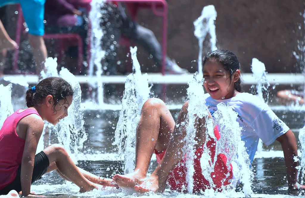Children cool off at the Grand Park splash pad in downtown Los Angeles, California on June 19, 2017, amid a Southern California heatwave. (FREDERIC J. BROWN/AFP via Getty Images)