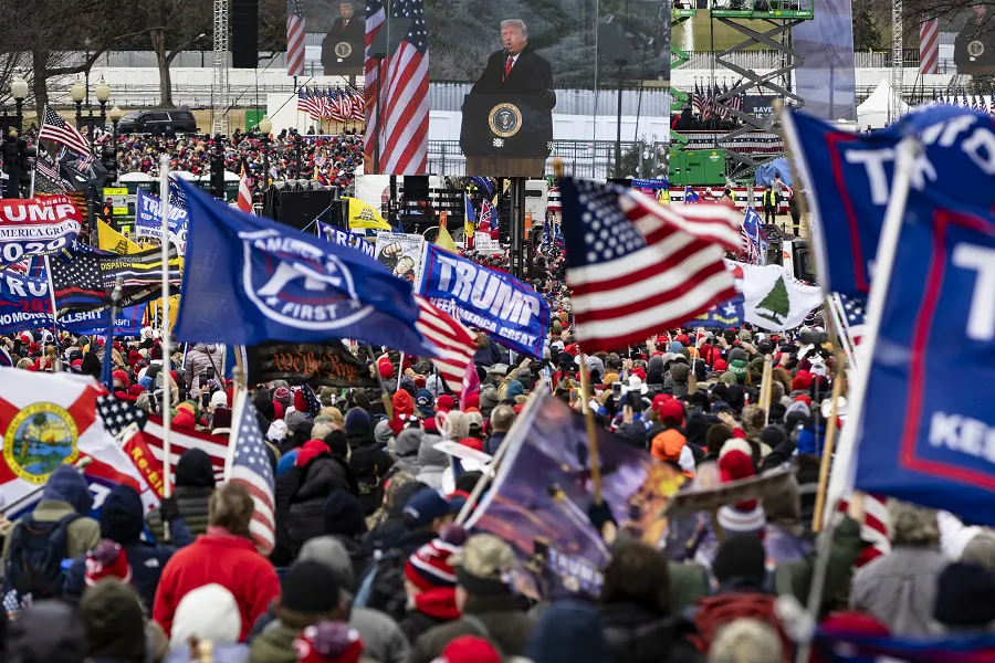 President Donald Trump is seen on a screen as his supporters cheer during a rally on the National Mall in Washington on Jan. 6, 2021. (Samuel Corum/Getty Images)
