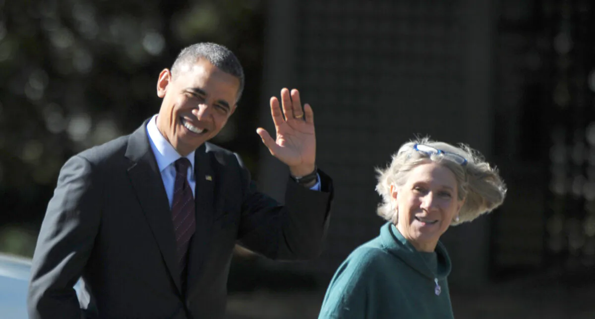 President Barack Obama walks with Senior White House Advisor Anita Dunn to debate preparation at the Kingsmill Resort in Williamsburg, Va., on Oct. 16, 2012. (Mandel Ngan/AFP via Getty Images)