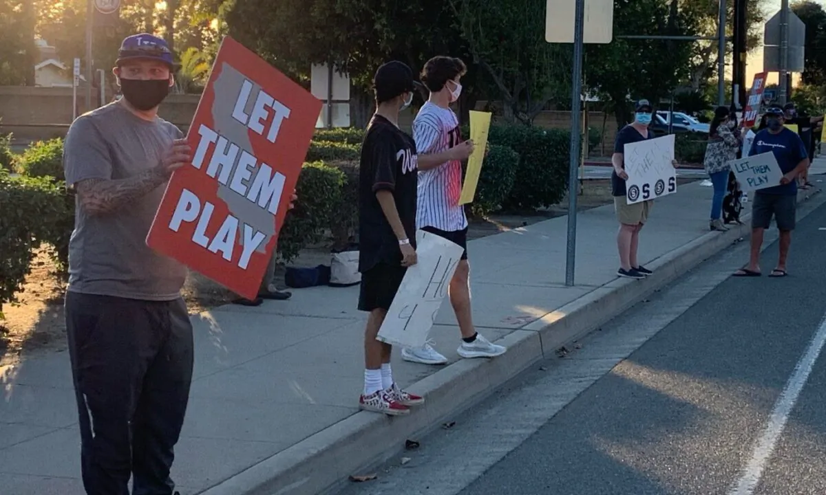 About 100 people rallied at a Fullerton high school Jan. 15, pushing for the chance to let high school athletes compete in outdoor sports during the ongoing pandemic.
(Courtesy of Jason Jamison)