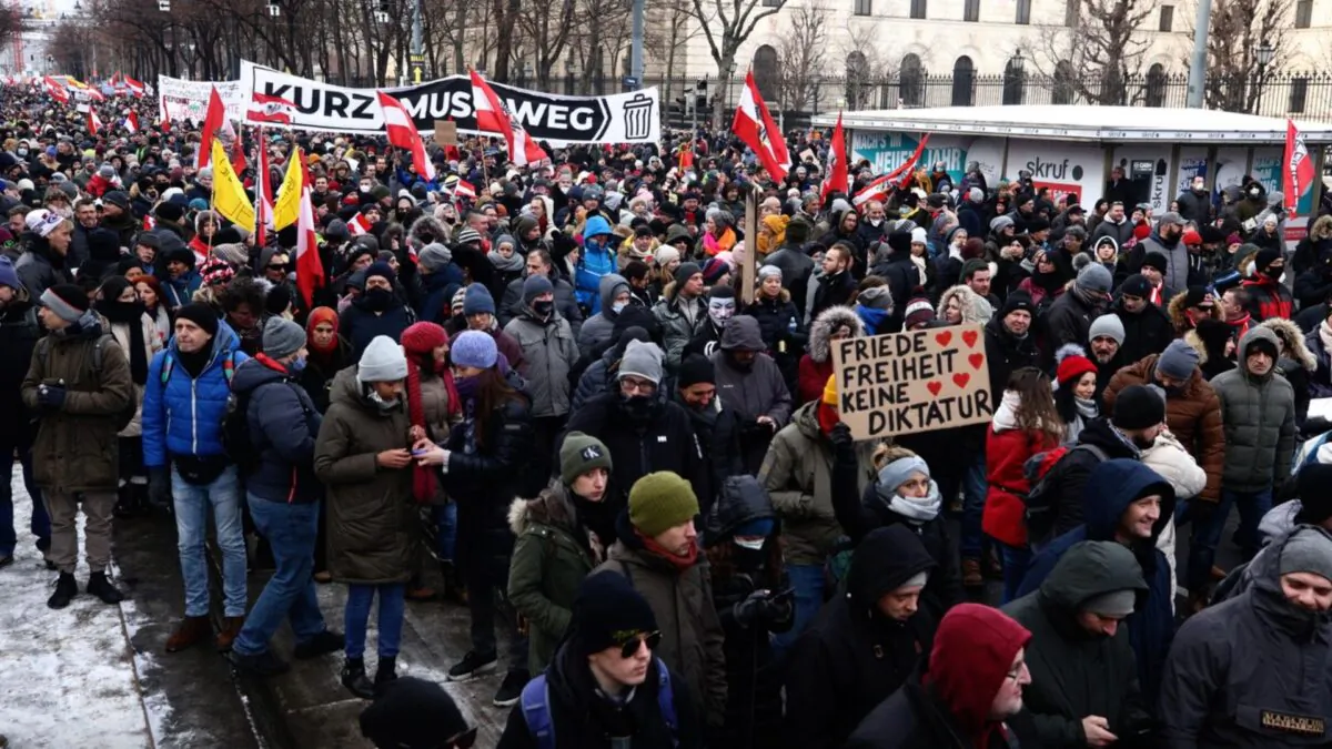 Protestors hold a banner reading ''Kurz must go'' at Maria Theresien Platz during a demonstration against COVID-19 measures and their economic consequences in Vienna, Austria on Jan. 16, 2021. (Lisi Niesner/Reuters)