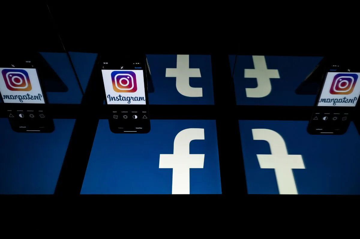 Logos of social networks Facebook and Instagram on the screens of a tablet and a mobile phone in a file photo. (Lionel Bonaventure/AFP via Getty Images)