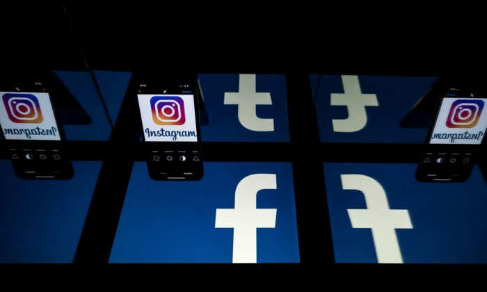 Logos of social networks Facebook and Instagram on the screens of a tablet and a mobile phone in a file photo. (Lionel Bonaventure/AFP via Getty Images)