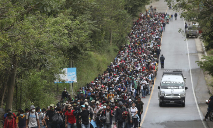 Migrants hoping to reach the U.S. border walk alongside a highway in Chiquimula, Guatemala, on Jan. 16, 2021. (Sandra Sebastian/AP Photo)