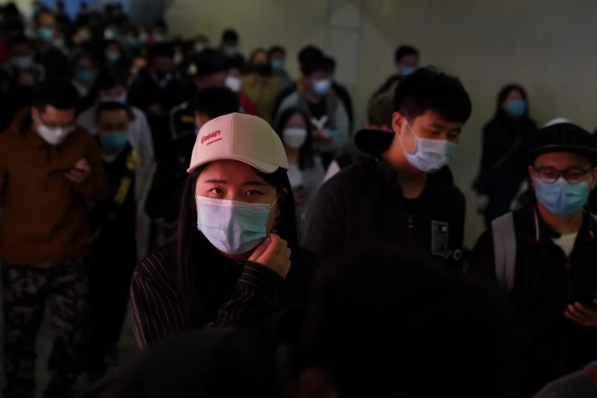 Commuters exit a train at a subway station in Beijing, on April 20, 2020. (Lintao Zhang/Getty Images)