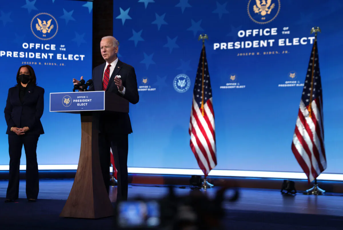 Then-President-elect Joe Biden (R) speaks at The Queen theater in Wilmington, Delaware, on Jan. 15, 2021. (Alex Wong/Getty Images)