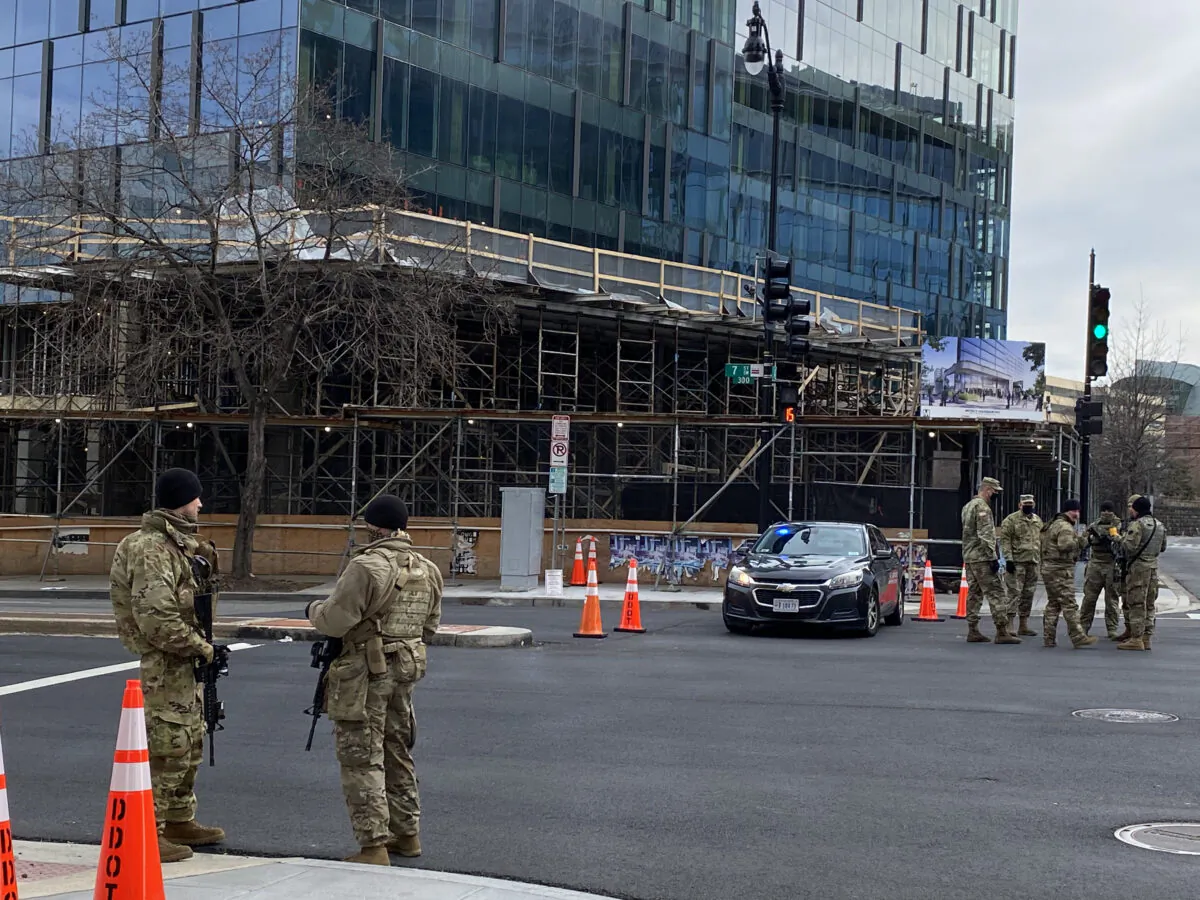 National guard soldiers outside of L’Enfant Plaza metro station in Washington on Jan. 17, 2021. (Terri Wu / Epoch Times)