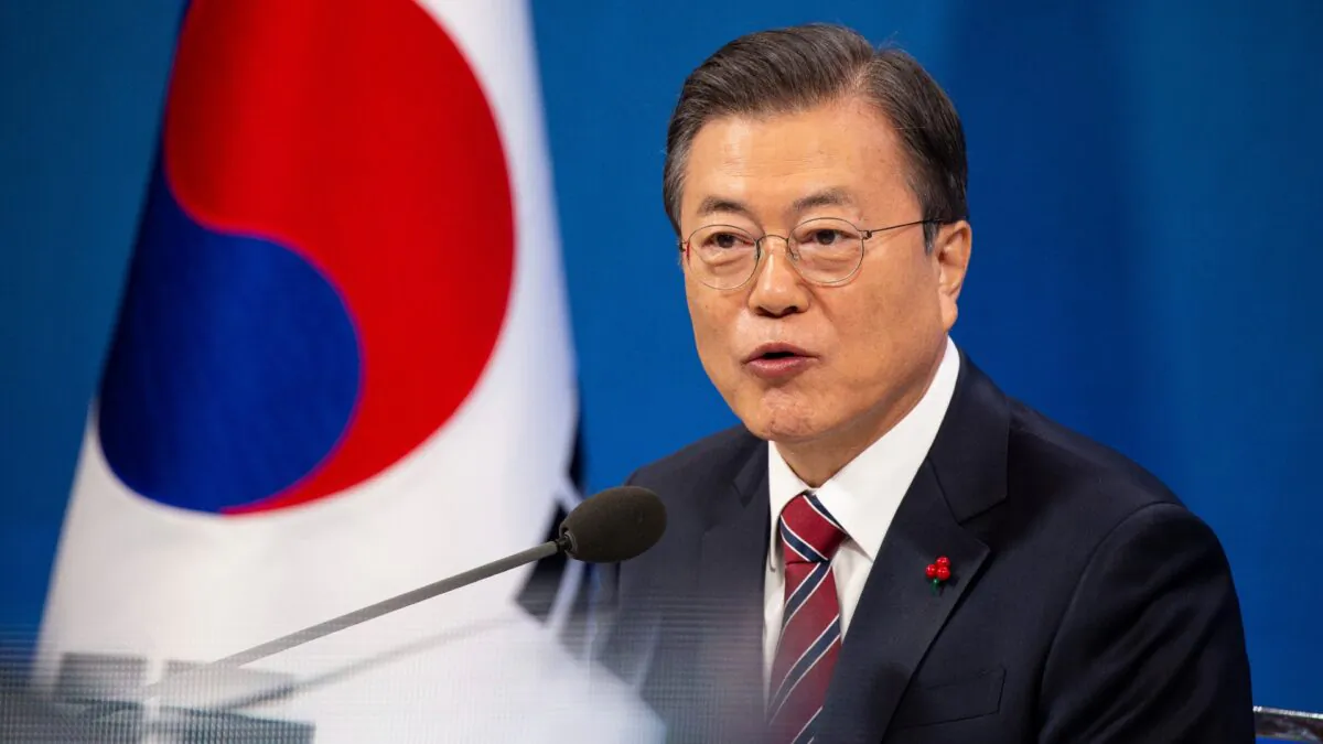 South Korean President Moon Jae-in speaks during an on-line New Year press conference with local and foreign journalists at the Presidential Blue House in Seoul, South Korea, on Jan. 18, 2021. (Jeon Heon-kyun/Pool Photo via AP)