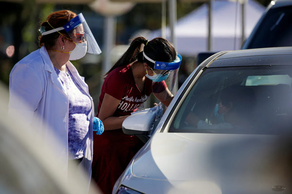 Mass-vaccination of health care workers against COVID-19 at Dodger Stadium in Los Angeles, on Jan. 15, 2021. (Irfan Khan/Pool via Reuters)