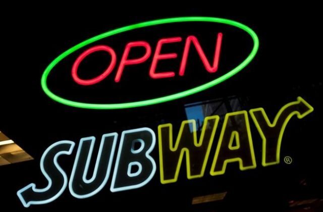 A Subway fast food restaurant sign is shown in New York on Oct. 24, 2016. A defamation lawsuit by the world’s largest fast-food operator against Canada's public broadcaster over a report on the chain's chicken sandwiches can proceed, Ontario's top court has ruled. (The Canadian Press/AP/Mark Lennihan)