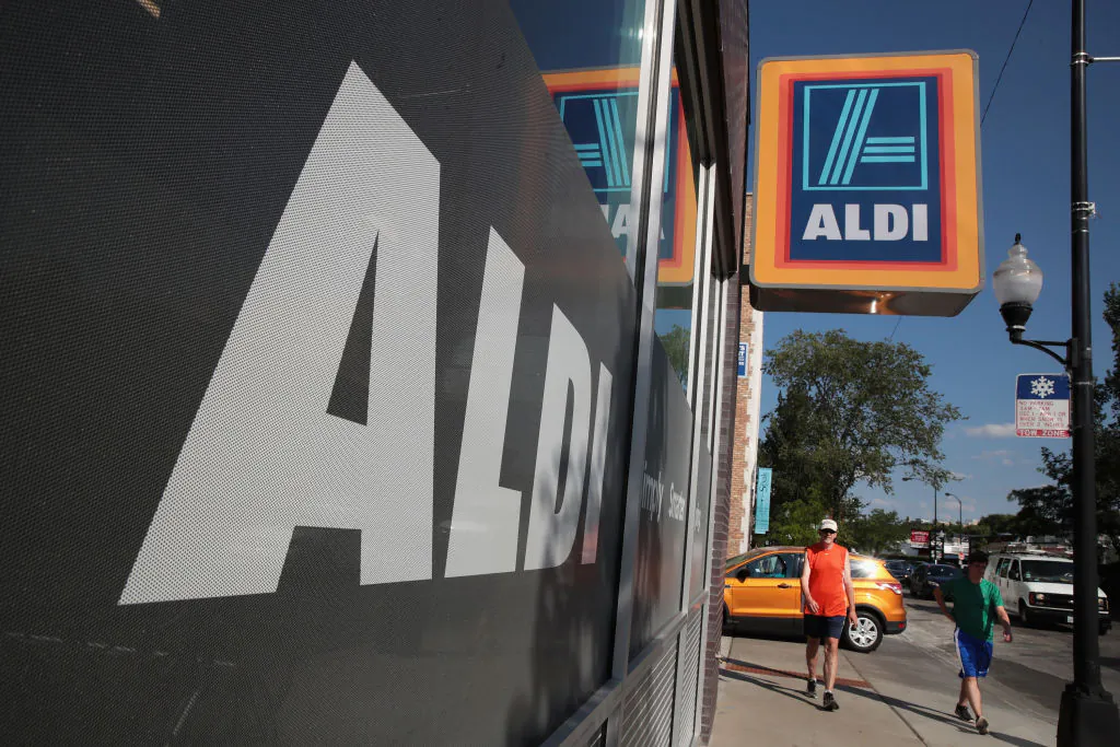 A sign hangs outside an Aldi grocery store in Chicgo, Ill., on June 12, 2017. (Scott Olson/Getty Images)