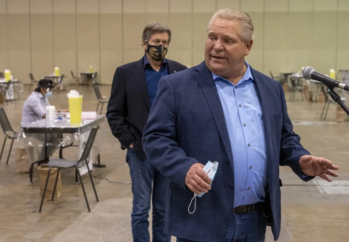 Ontario Premier Doug Ford and Toronto Mayor John Tory after a tour of Toronto's mass vaccination clinic on  Jan. 17, 2021. (Frank Gunn/The Canadian Press)
