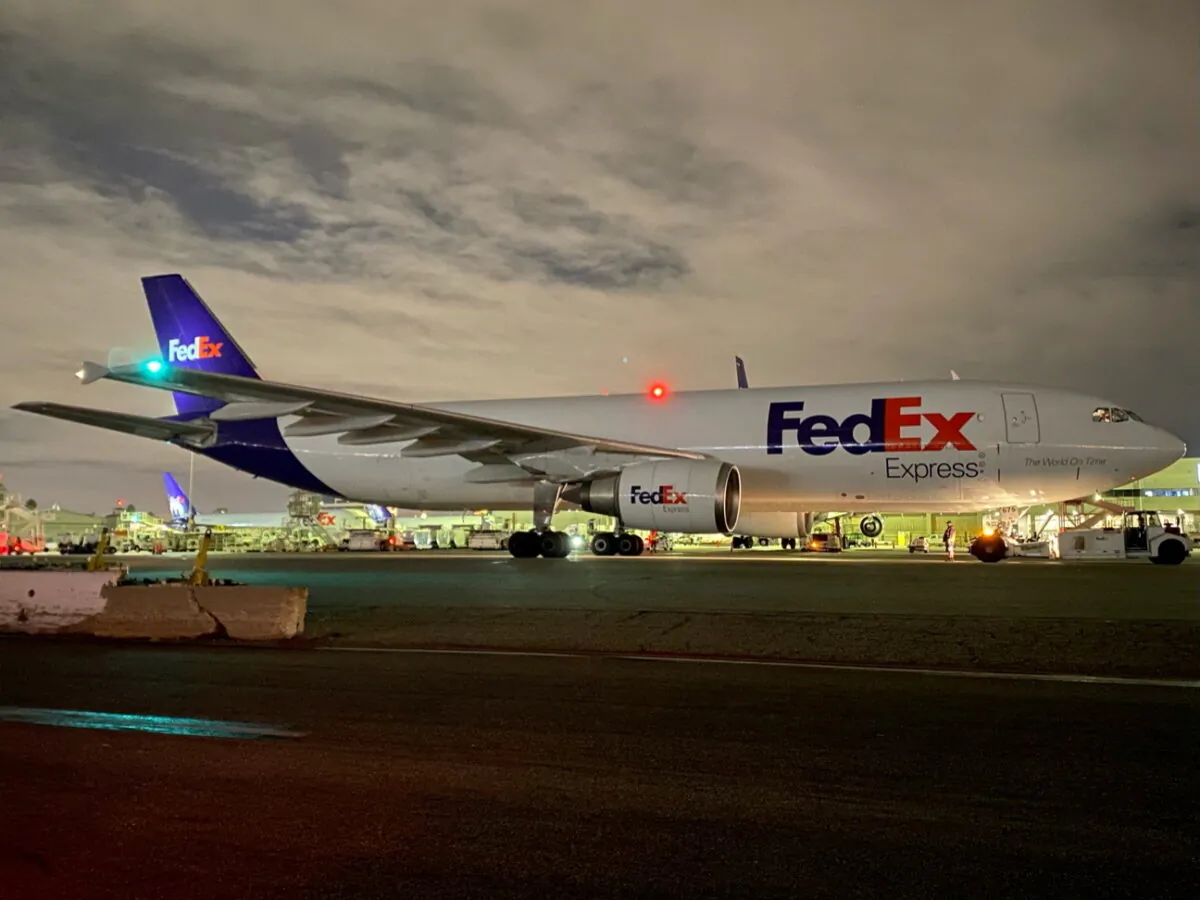 A plane of FedEx Express carrying a first batch of Pfizer/BioNTEch COVID-19 vaccine is seen at LAX Airport, in Los Angeles, Calif., on Dec. 13, 2020. (Los Angeles World Airports/via Reuters)