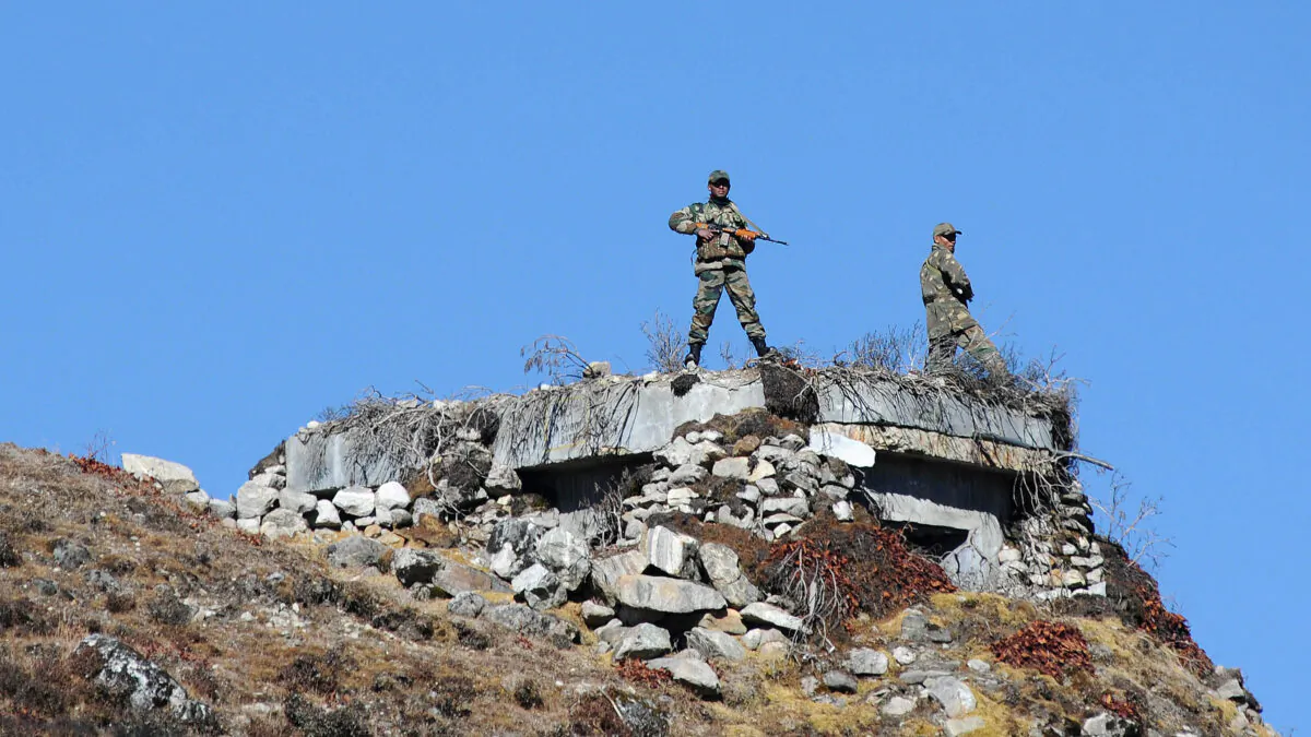 Indian Army personnel stand guard at Bumla pass at the India-China border in Arunachal Pradesh on Oct. 21, 2012. According to Indian media reports, the Chinese have built 101 houses, 2.5 miles inside the Indian territory in an area inside Arunachal Pradesh.
(BIJU BORO/AFP via Getty Images)