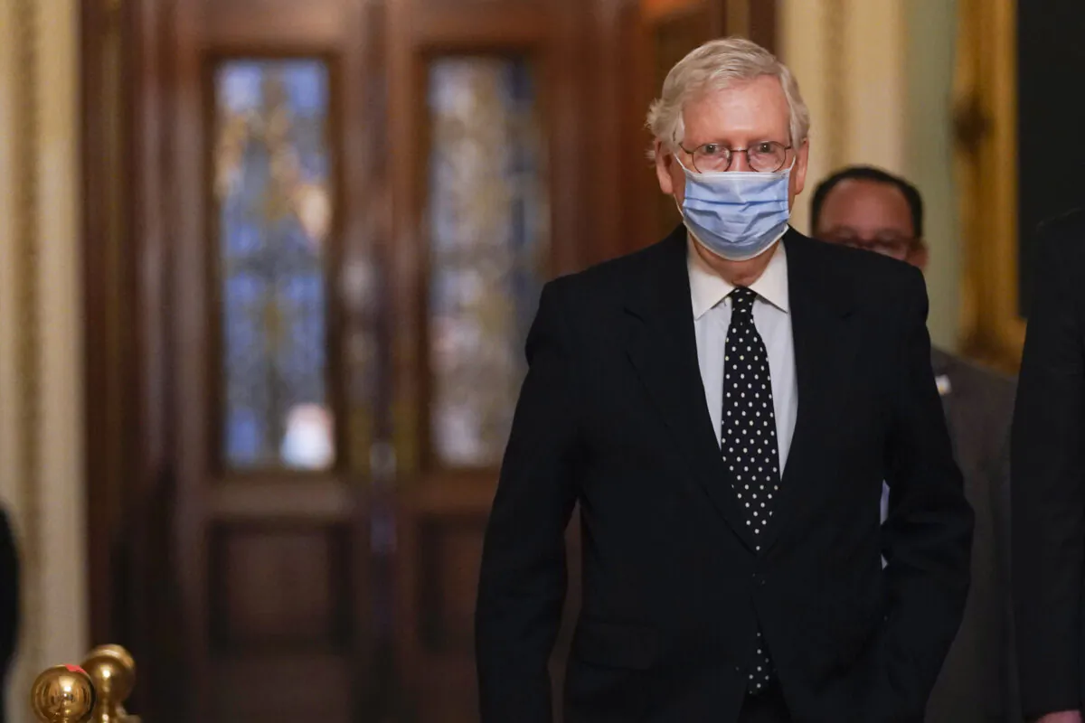 Senate Majority Leader Mitch McConnell (R-Ky.) walks on Capitol Hill in Washington on Jan. 6, 2021. (Manuel Balce Ceneta/AP Photo)