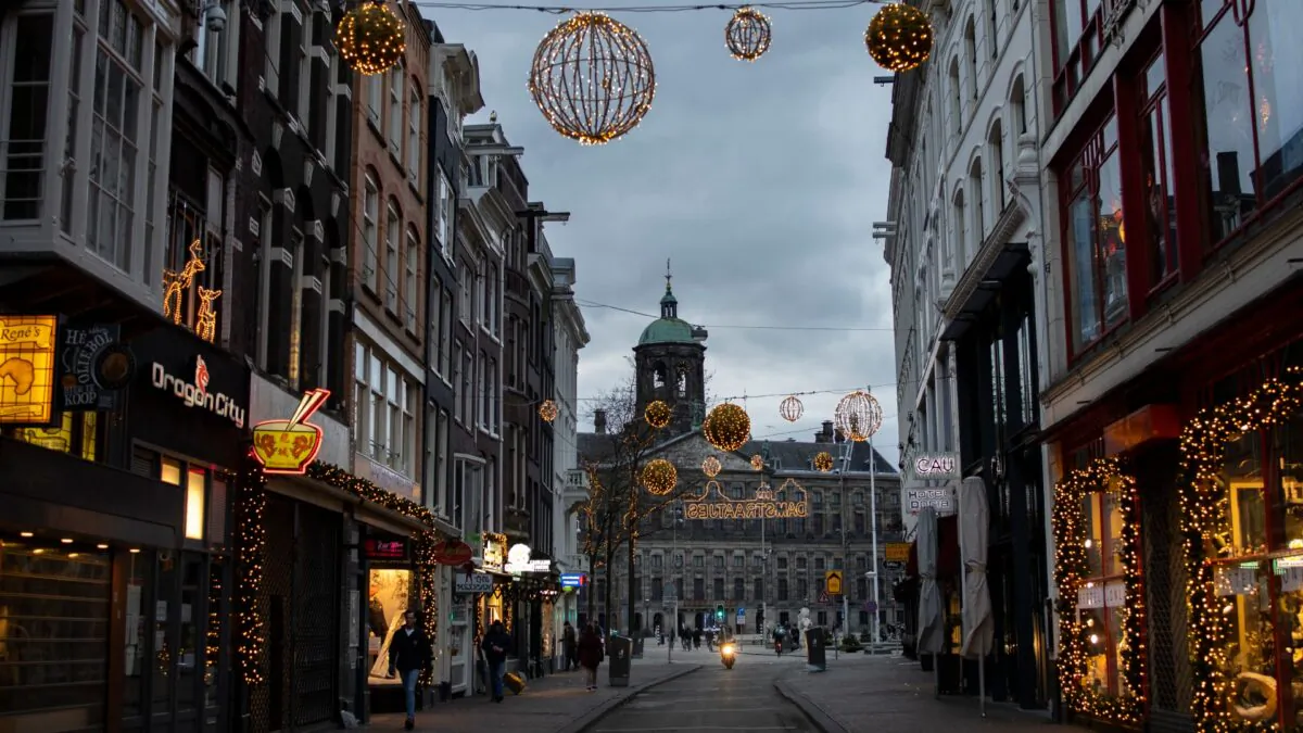 Closed stores on Dam street and the Royal Palace on Dam Square are seen in Amsterdam, Netherlands, on Jan. 14, 2021. (Peter Dejong/AP Photo) 