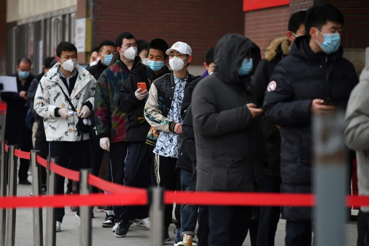 People line up outside a hospital to get COVID-19 tests in Beijing, China on Jan. 14, 2021. (GREG BAKER/AFP via Getty Images)