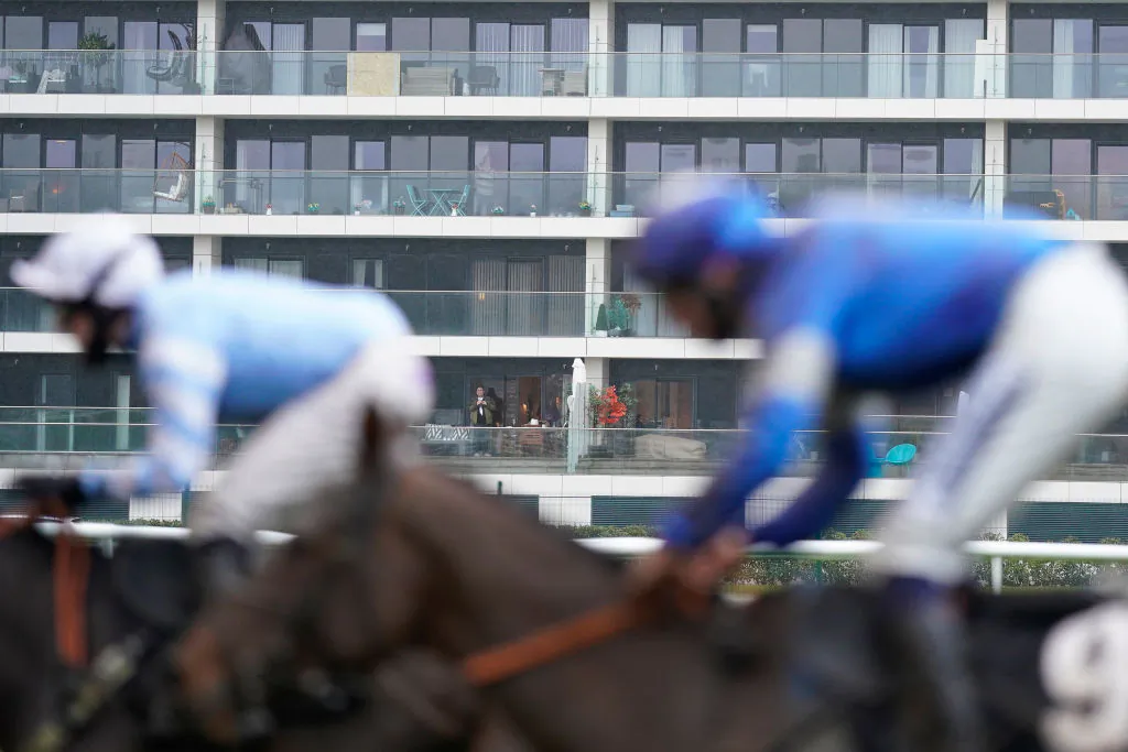 A general view as a resident of a flat that overlooks the course watches the action at Newbury Racecourse on January 20, 2021 in Newbury, England. (Alan Crowhurst/Getty Images)