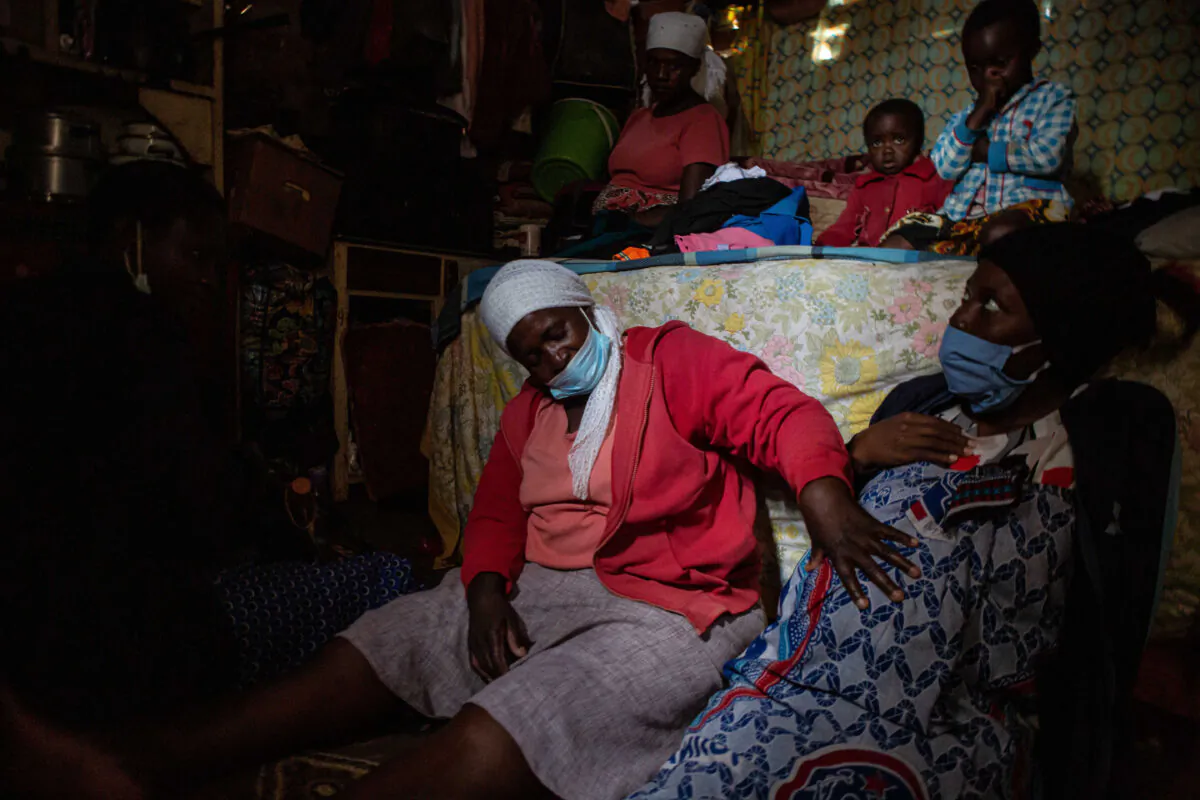Midwife Angeless Kanzara examines a pregnant woman to assess whether she is ready to give birth, in Harare, Zimbabwe, on Jan. 14, 2021. (Tafadzwa Ufumeli/Getty Images)